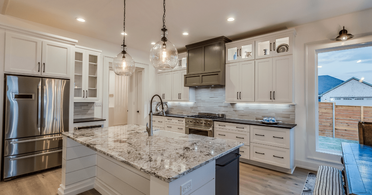 Kitchen with hanging light fixtures.