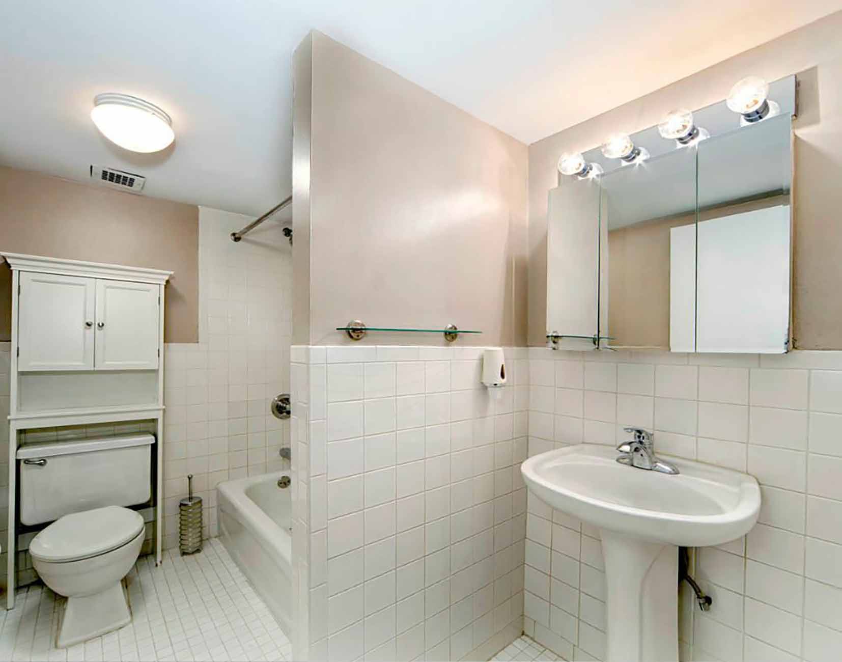 Before photo of a small loft apartment bathroom.