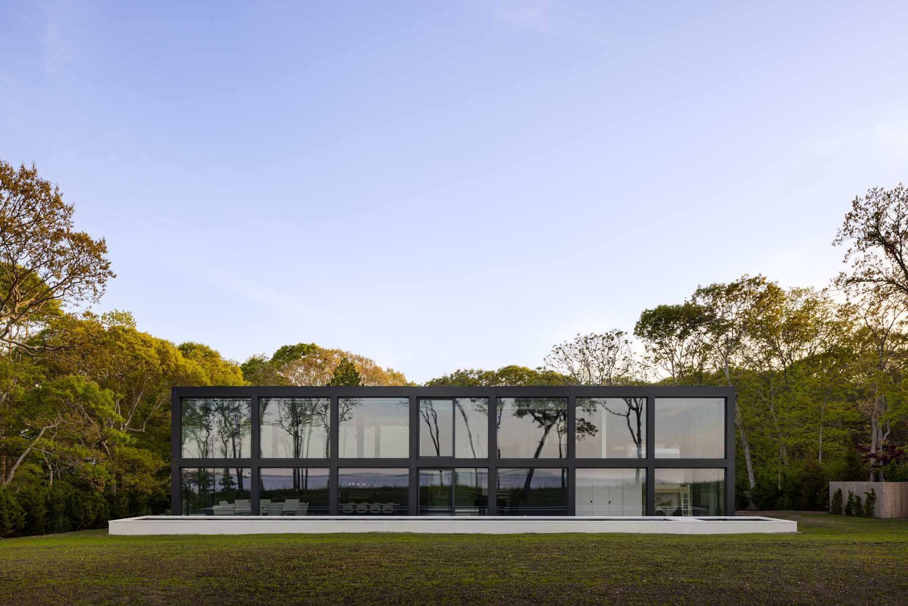 A modern home with a grid-inspired exterior and large windows.