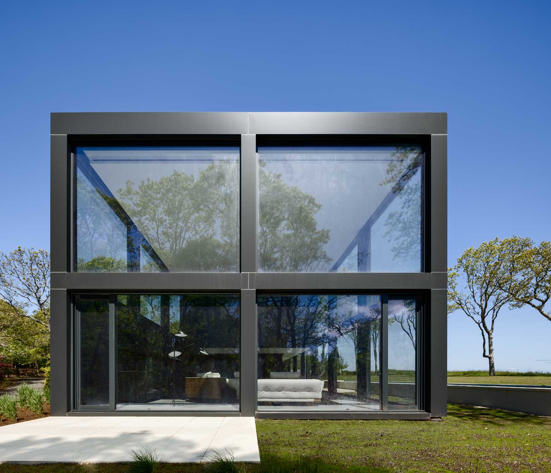 A modern home with a grid-inspired exterior and large windows.