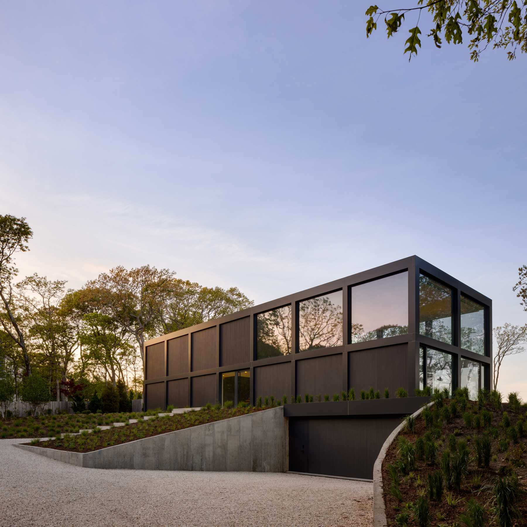 A modern home with a grid-inspired exterior and large windows.