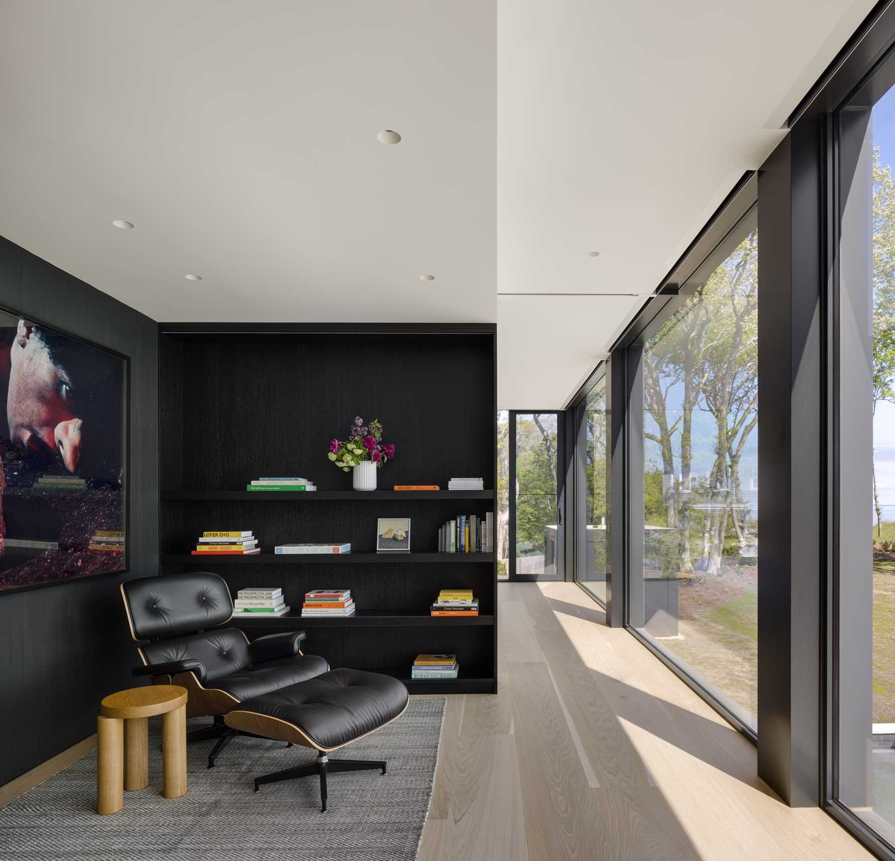 A small library with floating shelves that blend into the wall.